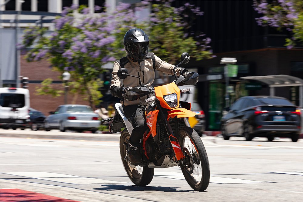 Dustin rides the 390 Enduro R down an urban thoroughfare.