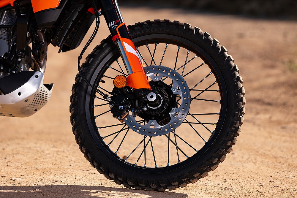 A close-up of the 390 Enduro R's front wheel.