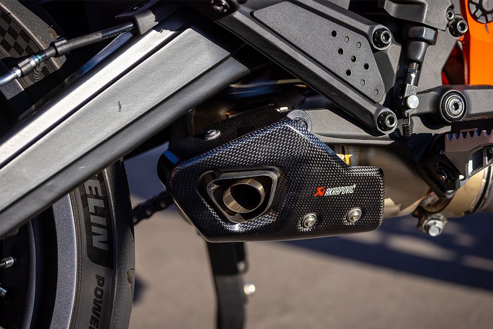 A close-up of the 390 SMC R's accessory Akrapovic end can. 