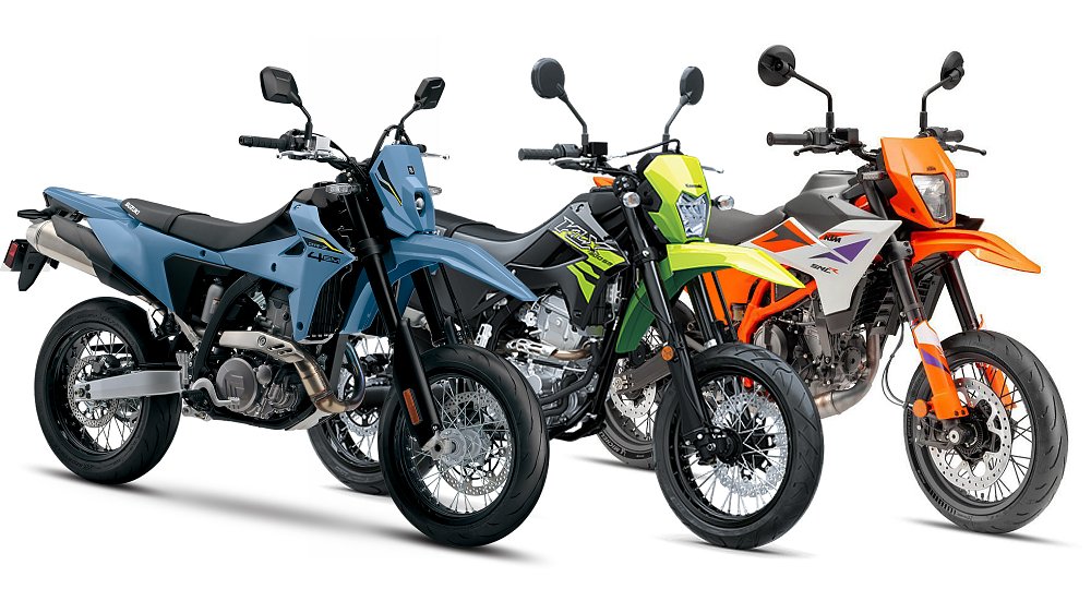The Suzuki DR-Z4SM, Kawasaki KLX300SM, and KTM 390 SMC R all pictured against a white background.