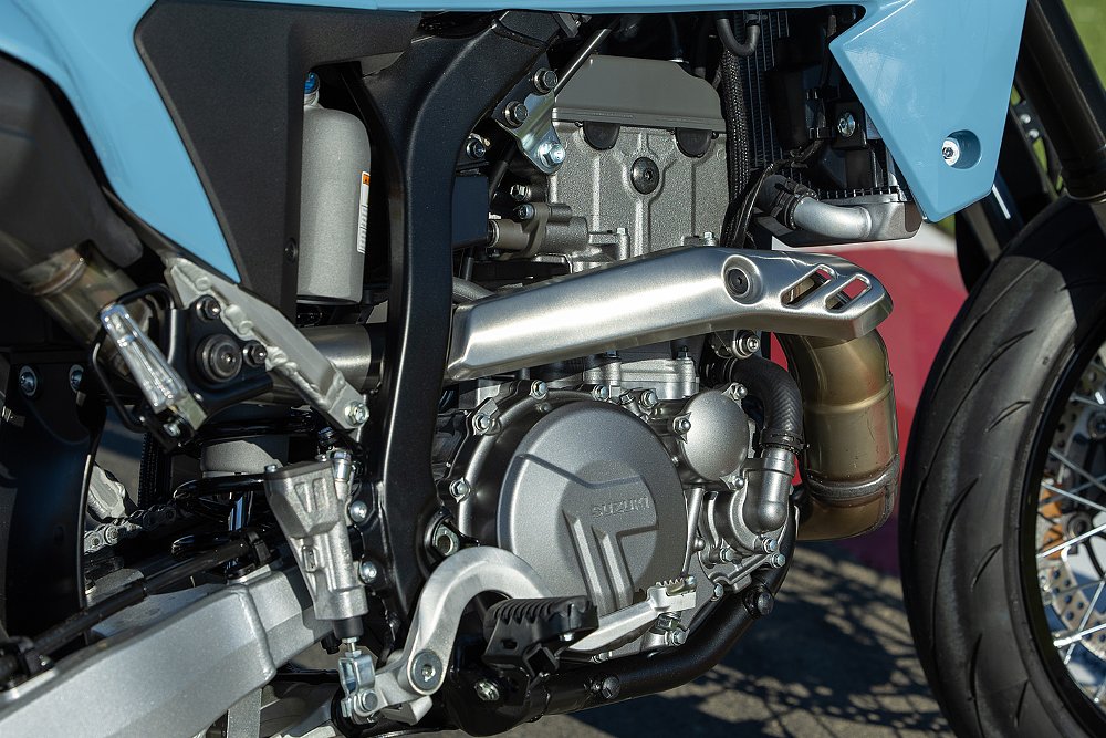 A close-up of the DR-Z4SM' 398 cc single-cylinder engine.