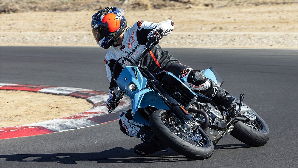Dustin pushes the DR-Z4SM's front end through a hairpin turn on track.