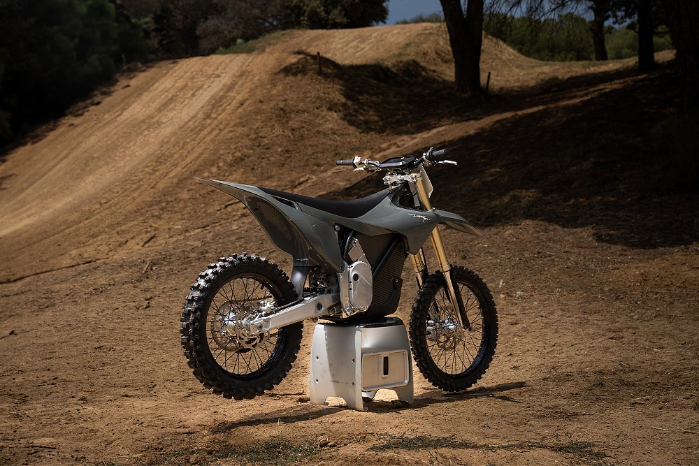 The Stark VARG MX 1.2 staged by a motocross jump.