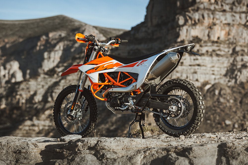 A shot of the KTM 690 Enduro R rear end while its staged against a mountain.