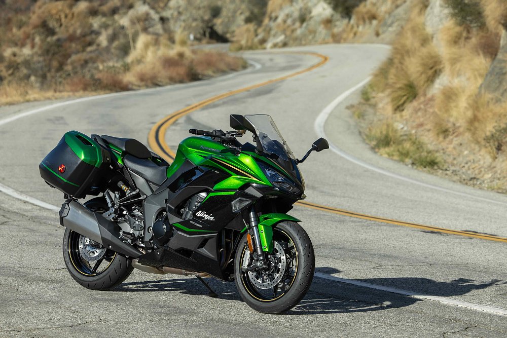 2025 Kawasaki Ninja 1100 SX SE parked on the side of a twisty road.