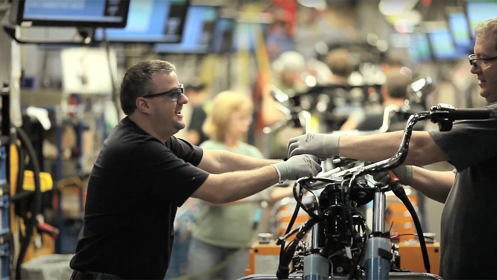 Two production-line employees converse at Harley-Davidson's York, Pennsylvania plant.