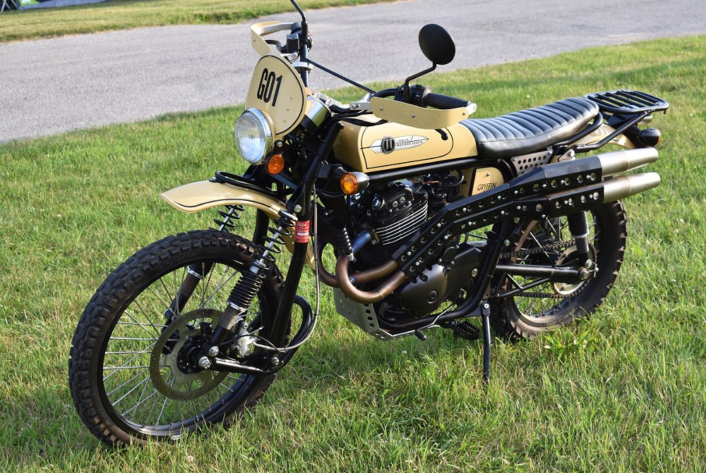 side view of the yellow, lightweight, scrambler-style Janus Gryffin 450