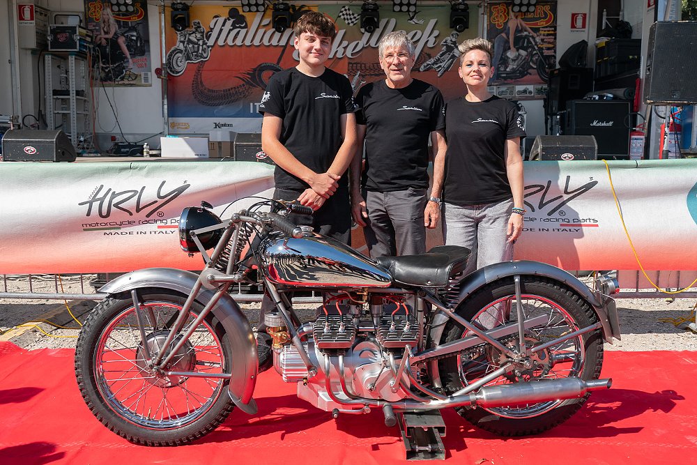 Friulian restorer and motorcycle builder Mirco Snaidero stands next to his faithful recreation of the Galbusera 500 V8.