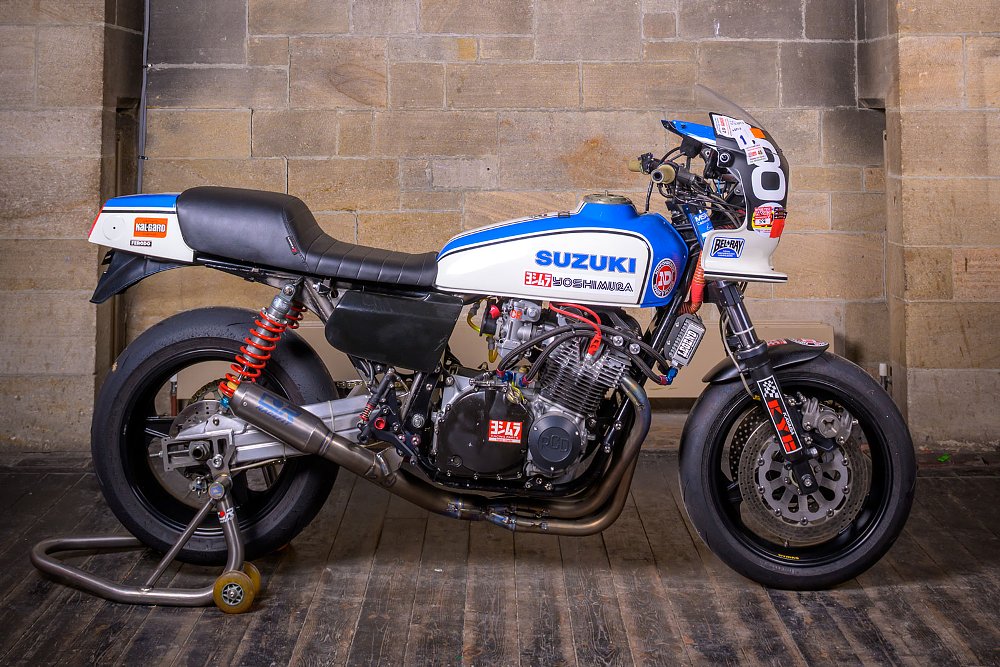 a blue and white Suzuki custom with a bikini fairing