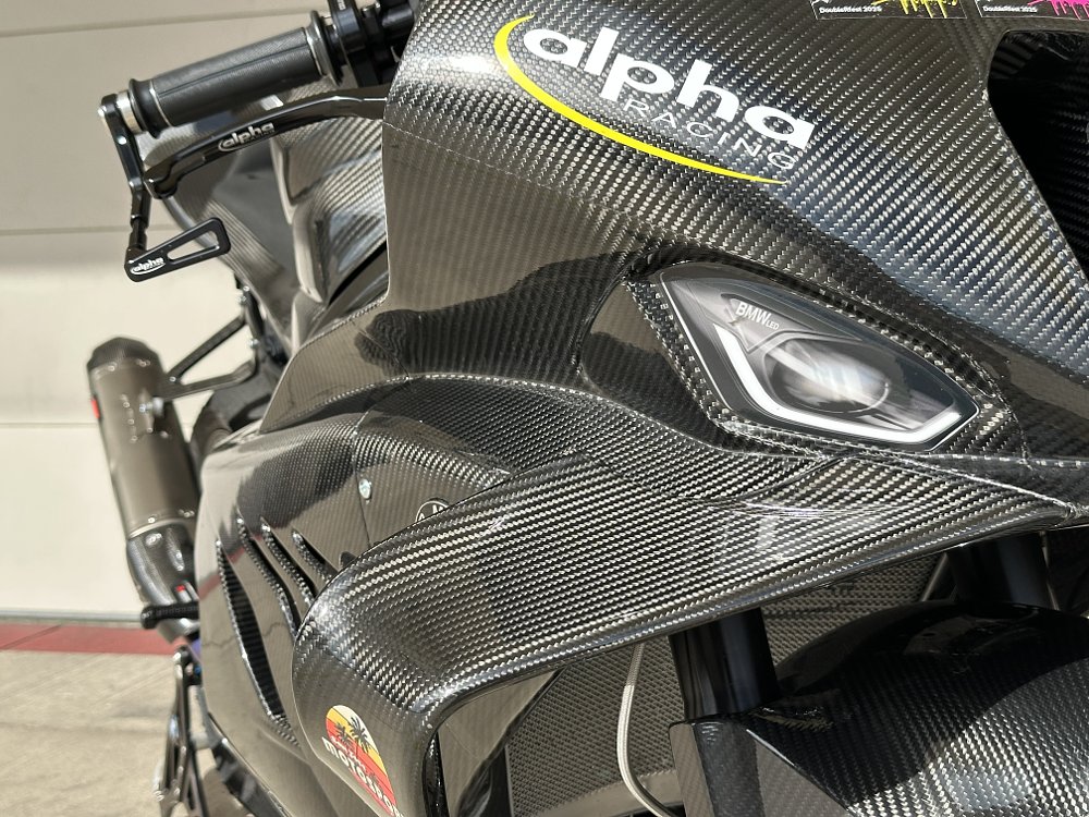 2025 alpha Racing M 1000 RR carbon-fiber aerodynamic winglet detail.