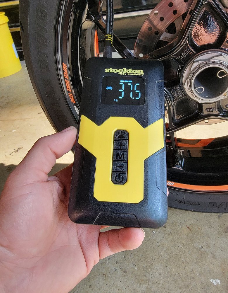 image of battery-powered handheld pump in use