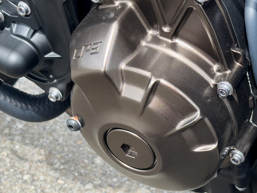 A close-up of the CP3 inline-triple engine's side cases.