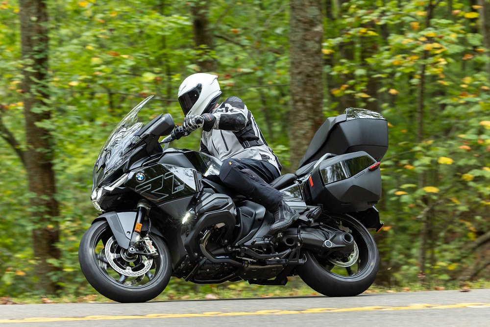 rider on the R 1300 RT in a curve in a forest