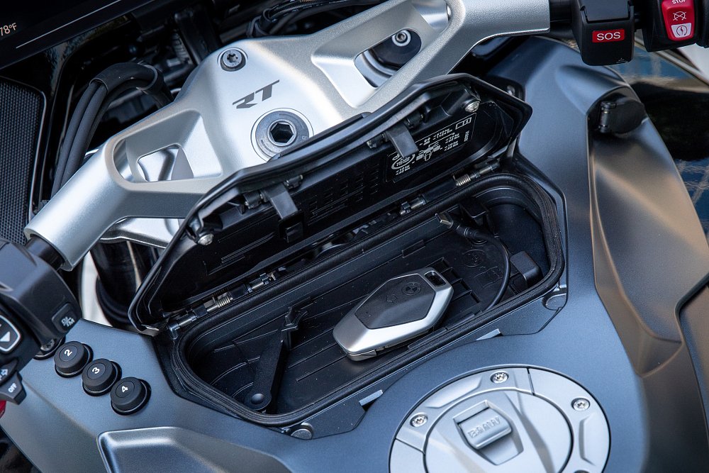 compartment that holds a phone in place with a charger