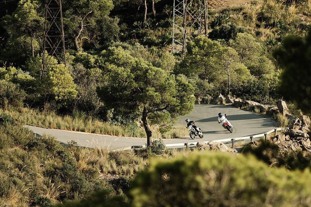 Two Stark VARG SM riders wind through curvy mountain roads.