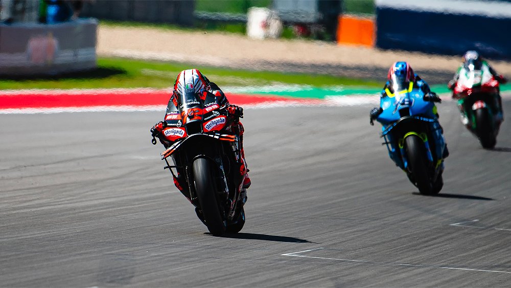Aprilia Factory MotoGP rider Marco Bezzecchi fires his RS-GP25 down CoTA's back straight.